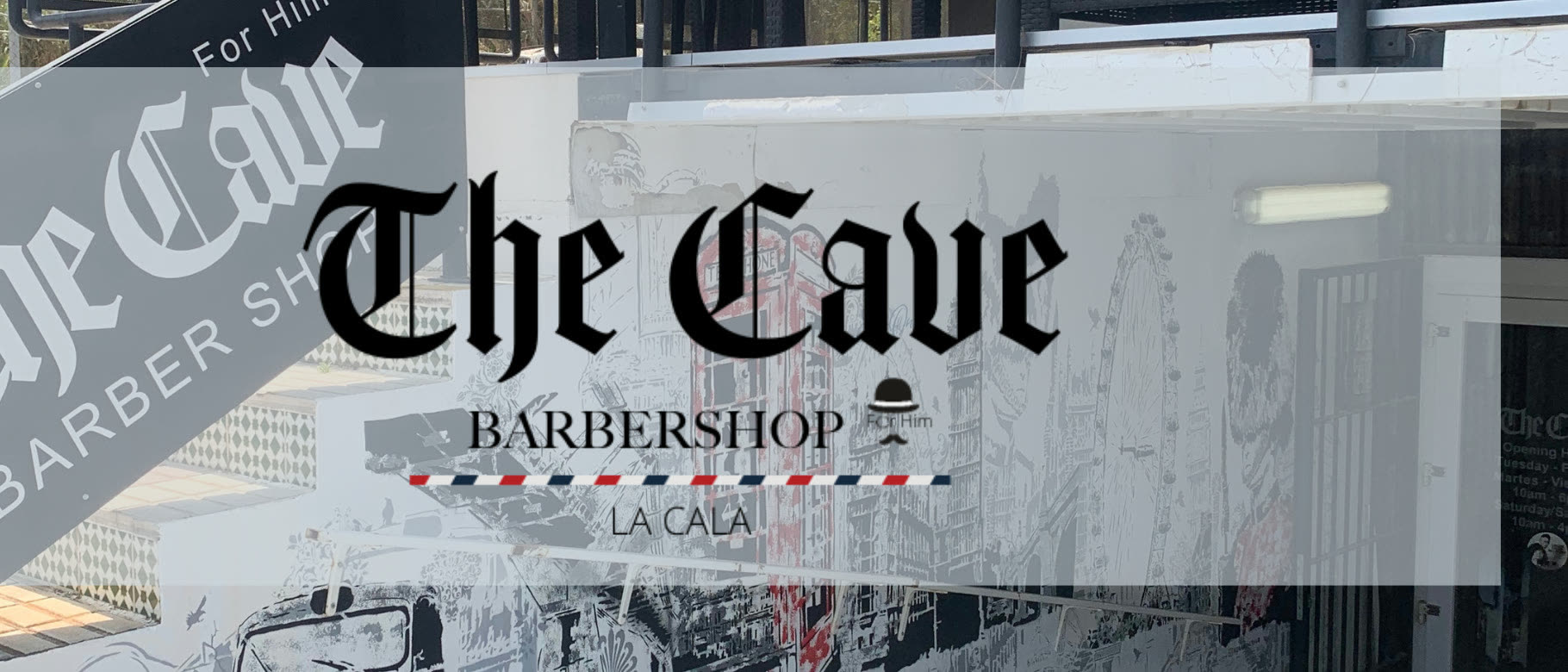 The Cave barbershop shopfront and painted London mural on Avenida Las Gardenias, La Cala de Mijas