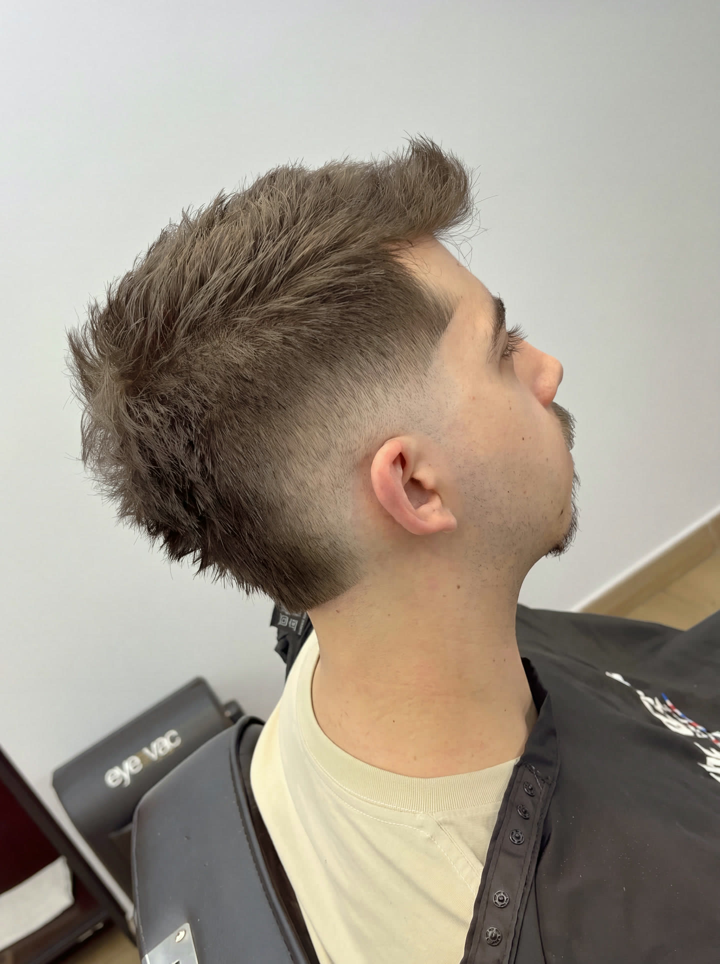 Skin fade, squared at the temple
